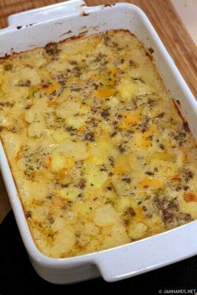 White casserole dish with baked Hissy Fit Dip inside.