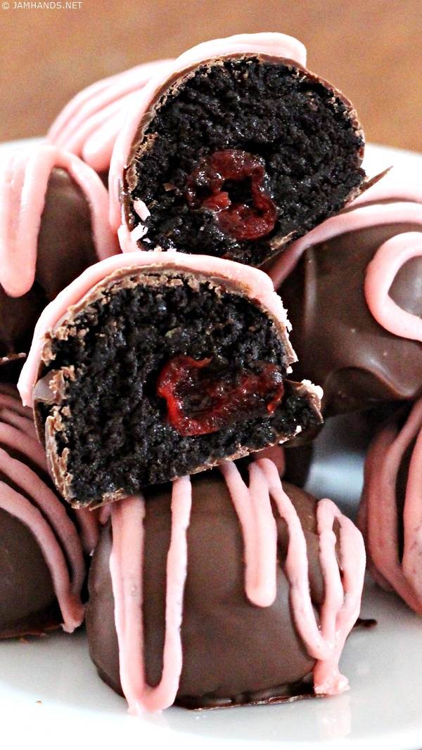 Close up of a cross section of Cherry Oreo Truffles.