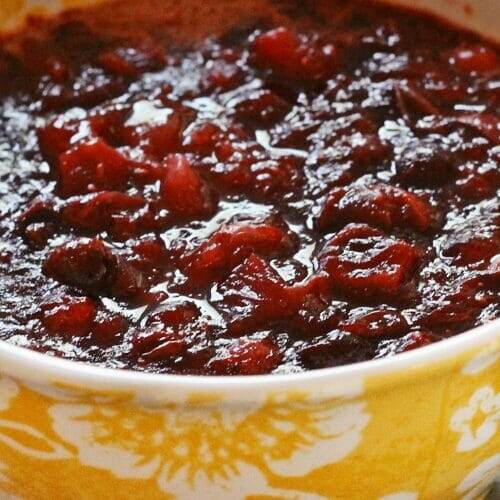 Top down view of Jell-O Cranberry Relish in a yellow serving bowl.