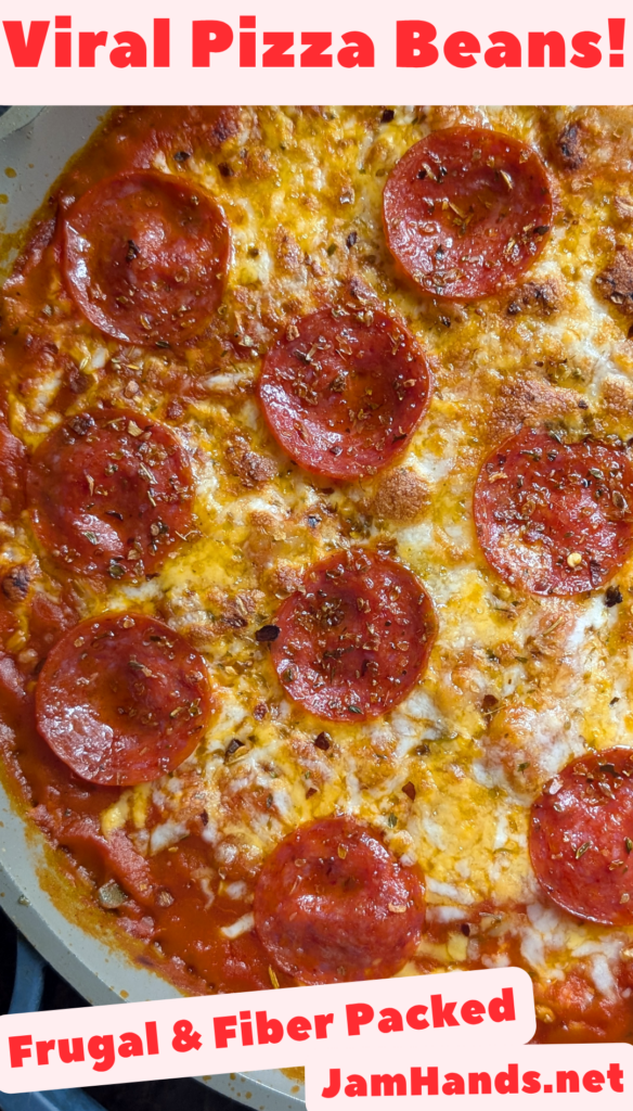 Close up photo of baked pizza beans with melted and browned cheese on top with crispy pepperoni.